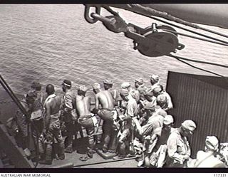 NAURU ISLAND. 1945-09-18. JAPANESE POWS ON THE DECKS OF THE RAN VESSEL, THE HMAS GLENELG, DURING THEIR EVACUATION TO BOUGAINVILLE SOON AFTER TROOPS OF THE 31/51ST INFANTRY BATTALION TOOK OVER THE ..