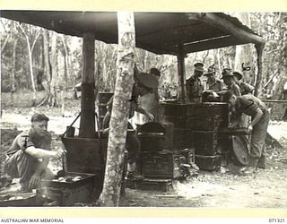 SCARLET BEACH, NEW GUINEA, 1944-03-19. ARMY COOKS RECEIVING TRAINING IN FIELD COOKING AND CATERING AT THE 22ND INFANTRY BATTALION, 5TH DIVISION AND SUPERVISED BY WARRANT OFFICER II, R. STEWART, ..