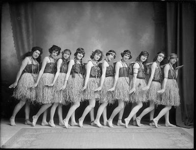 Young female performers in grass skirts