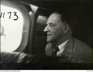 IN FLIGHT BETWEEN HOLLANDIA, DUTCH NEW GUINEA AND AITAPE, NORTH EAST NEW GUINEA. C. 1944-06. ARTHUR DRAKEFORD, THE MINISTER FOR AIR, DURING THE FLIGHT, PART OF HIS VISIT TO RAAF UNITS IN THE NEW ..