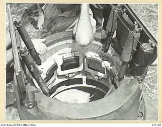 GUSIKA, NEW GUINEA. 1944-03-15. A CUPOLA POSITIONED ON A MATILDA TANK. IT IS DESIGNED TO PROTECT THE TANK COMMANDER'S HEAD AND GIVE ALL ROUND VISION UNDER FIRE. TESTS ARE BEING CONDUCTED FOR ITS ..