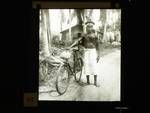 Native medical orderly with a bicycle, New Guinea, c1924 to ?