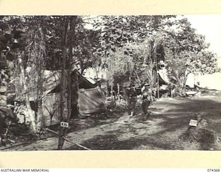 SIAR, NEW GUINEA. 1944-06-25. THE ADMINISTRATION SECTION OF NO.7 PLATOON, A COMPANY, 57/60TH INFANTRY BATTALION. IDENTIFIED PERSONNEL ARE:- VX56025 LIEUTENANT R.S. JACKSON, MC (1); VX81103 MAJOR W. ..