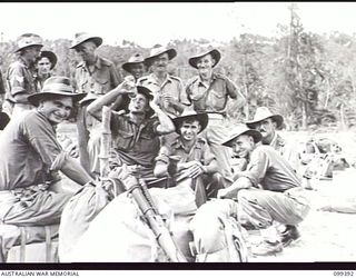 RABAUL, NEW BRITAIN, 1945-12-08. A HAPPY GROUP OF 11 DIVISION TROOPS WITH HIGH PRIORITY FOR DISCHARGE WAITING TO EMBARK ON HMAS WESTRALIA FOR RETURN TO AUSTRALIA