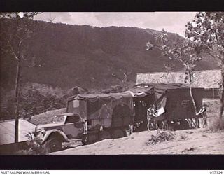 SEVENTEEN MILE, NEW GUINEA. 1943-09-23. SECTION AND MOTOR TRANSPORTS OF THE 2/1ST AUSTRALIAN ARMY TOPOGRAPHICAL SURVEY COMPANY. SHOWN: VX70401 SAPPER (SPR) P. L. COURTNEY (1); VX142198 SPR H. V. ..