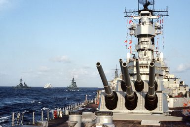 A close-up view of Mark 7 16-inch/50-caliber guns aboard the battleship USS MISSOURI (BB-63) as the vessel is underway with other ships of its battle group during exercise RIMPAC '90 near Hawaii