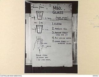 LAE AREA, NEW GUINEA, 1945-08-03. A "PIDGIN" ENGLISH CHART USED FOR THE INSTRUCTION OF NATIVE REGIMENTAL AID POST ORDERLIES. THE PHOTOGRAPH WAS MADE AT THE REQUEST OF HEADQUARTERS AUSTRALIAN NEW ..