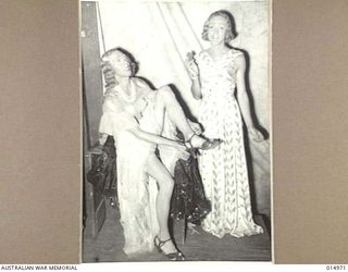 1943-06-09. NEW GUINEA. MILNE BAY. AN A.I.F. CONCERT PARTY ENTERTAINS TROOPS AT MILNE BAY. PERFORMANCES ARE GIVEN SIX NIGHTS A WEEK, THE PROGRAM BEING CHANGED TWICE A MONTH. TWO FEMALE ..