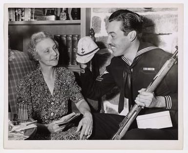 Cesar Romero Shows Mom His Souvenirs From Saipan