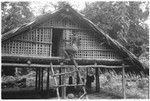 Man climbs to house