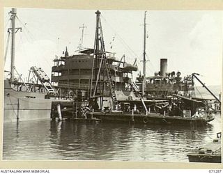 PORT MORESBY, PAPUA, 1944-03-21. THE OIL TANKER EMPIRE SILVER AT THE OIL WHARF WITH SUPPLY FOR THE 1ST BULK PETROLEUM STORAGE COMPANY, (NEW GUINEA FORCE). JOINS WITH NO.071288