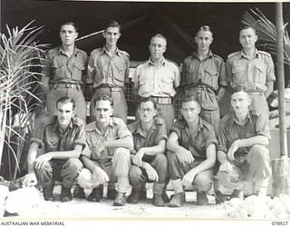 JACQUINOT BAY, NEW BRITAIN. 1945-02-03. PERSONNEL OF THE FIELD CASH OFFICE, HEADQUARTERS, 5TH DIVISION. IDENTIFIED PERSONNEL ARE:- SX32672 WARRANT OFFICER I, C.A. DAWSON (1); SX32729 SERGEANT J.G. ..