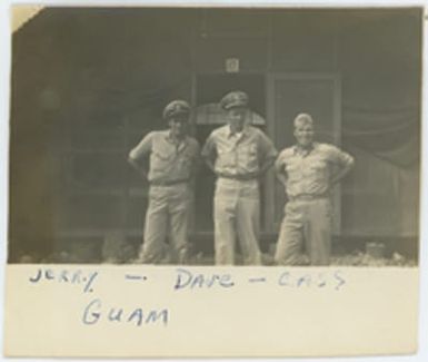 [Servicemen Jerry Michaud, Dave, and Cassedy standing outside BOQ]
