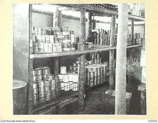 ORO BAY, NEW GUINEA. 1943-07. TINNED RATIONS IN A SECTION OF THE KITCHEN STORE OF THE 10TH FIELD AMBULANCE