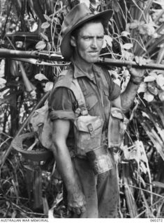 GUY'S POST, FARIA RIVER AREA, NEW GUINEA. 1943-11-08. SX20529 PRIVATE F. M. HEINZ OF PROSPECT, SA, AND OF THE 2/33RD AUSTRALIAN INFANTRY BATTALION MOVING TO GUY'S POST TO RELIEVE MEMBERS OF THE ..