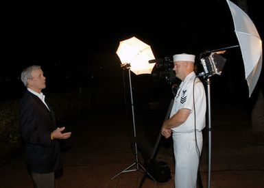 U.S. Navy Mass Communication SPECIALIST 1ST Class Keith Jones (right) interviews Tom Brokaw, NBC Nightly News Anchorman, at the USS ARIZONA Memorial Visitors Center at Pearl Harbor, Hawaii, on Dec. 7, 2006. The U.S. Navy/National Park Service held a joint ceremony commemorating the 65th Anniversary of the attack on Pearl Harbor. More than 1,500 Pearl Harbor survivors, their families and their friends from around the nation joined the more than 2,000 distiguished guests and the general public for the annual observance. (U.S. Navy photo by Mass Communication SPECIALIST 2nd Class Justin P. Nesbitt) (Released)