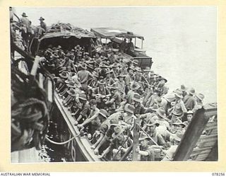 SIPAAI, BOUGAINVILLE ISLAND. 1945-01-07. A BARGE OF THE 42ND LANDING CRAFT COMPANY, LOADED WITH TROOPS OF THE 31/51ST INFANTRY BATTALION PREPARING TO DRAW AWAY FROM THEIR TRANSPORT, THE AV1361 ..