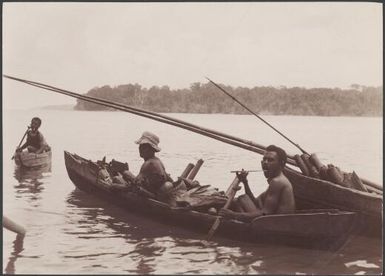 Men from Foate in canoes, Solomon Islands, 1906 / J.W. Beattie
