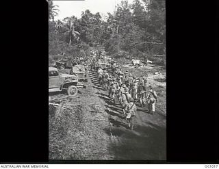 AITAPE, NORTH EAST NEW GUINEA. 1944-04-22. RAAF GROUND CREWS WHO LANDED WITH AMERICAN SHOCK TROOPS, THE FIRST RAAF PERSONNEL TO GO INTO ACTION WITH LAND FORCES ON INVASION DAY, MARCH IN BATTLE ..