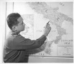 1st Lt. Shigeru Tsubota points out where he was serving in Italy with the 100th Battalion. Lt. Tsubota is a
