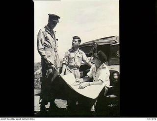 VIVIGANI, GOODENOUGH ISLAND, PAPUA. C. 1944-10. WARRANT OFFICER K. ELLIOTT, BALLARAT, VIC, NAVIGATOR, 6 FT 4 1/2 INS (LEFT), AND SERGEANT A. MCDONALD, CESSNOCK, NSW, WIRELESS AIR GUNNER, 5 FT 4 1/2 ..