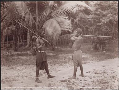 Two men fighting with clubs, Torres Islands, 1906, 2 / J.W. Beattie