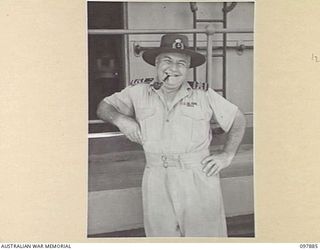 OFF BORAM BEACH, NEW GUINEA. 1945-10-13. CAPTAIN O.K. SNOWBALL, SKIPPED OF HMAS KATOOMA. HE HAS HAD 41 YEARS AT SEA OF WHICH 32 HAVE BEEN ON THE KATOOMBA. DURING THIS WAR HE HAS TRANSPORTED 100,000 ..