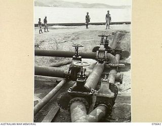 PORT MORESBY, PAPUA 1944-02-26. MANIFOLD VALVES OF THE DIESEL OIL AND DISTILLATE OIL JUNCTIONS AT THE BULK OIL INSTALLATIONS OF THE 1ST PETROLEUM STORAGE COMPANY