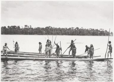 Papuan warriors in their canoes, Lake Murray, Papua New Guinea, 1921? Frank Hurley