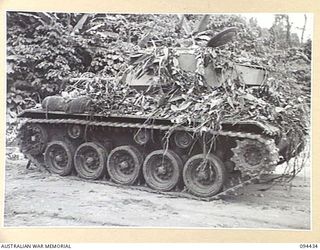 TOROKINA AREA, BOUGAINVILLE. 1945-07-28. THE GENERAL CONDITION OF OFF SIDE TRACKS OF AN M24 GENERAL CHAFFEE LIGHT TANK AFTER 3 HOURS 18 MINUTES IN DENSE JUNGLE DURING TESTS CONDUCTED FOR THE WAR ..
