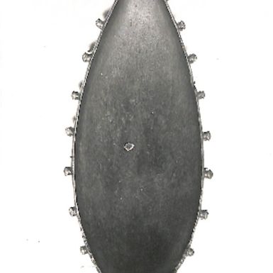 Photo of an oval-shaped wooden art piece. British Museum (LXIII/25)