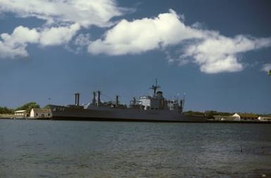 Port Bow view of the ammunition ship USS FLINT (AE 32) moored at the Powder Point ammunition pier