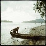 Man with boat at beach