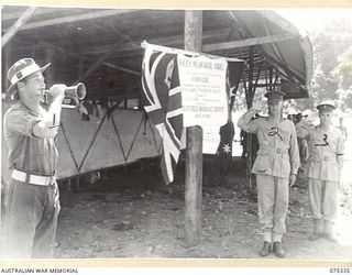 LAE, NEW GUINEA. 1944-08-13. LANCE CORPORAL F. INGLIS (1) SOUNDING THE "LAST POST" AT THE CONCLUSIION OF THE OFFICIAL OPENING CEREMONY OF THE CORPORAL RONALD RILEY MEMORIAL GROUND WHICH WAS ..