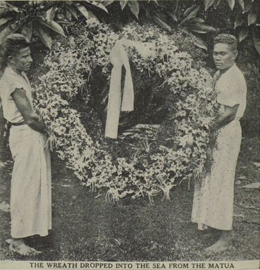 Two Samoan men with the wreath to be dropped into the sea during a memorial service for the flight crew that perished in the Samoan Clipper crash