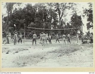 TOROKINA, BOUGAINVILLE. 1945-04-19. PATIENTS FROM THE 2/3 CONVALESCENT DEPOT ON THE VOLLEY BALL COURT AT THE NEW SPORTS OVAL