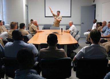 US Navy (USN) MASTER CHIEF PETTY Officer of the Navy (MCPON) Terry Scott (background), speaks to the Enlisted Sailors stationed at Commander, Navy Region Hawaii, during an All-Hands Call conducted during his visit at Pearl Harbor, Hawaii (HI)