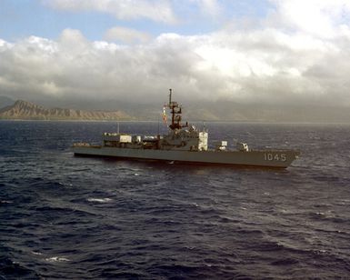 A starboard bow view of the frigate USS DAVIDSON (FF-1045) underway off Diamond Head