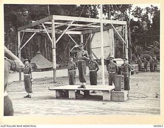 TOROKINA, BOUGAINVILLE, SOLOMON ISLANDS. 1944-12-15. MAJOR GENERAL W. BRIDGEFORD, GENERAL OFFICER COMMANDING 3 DIVISION, (6), TAKING THE SALUTE FROM 47 INFANTRY BATTALION (LESS C COMPANY), 29 ..