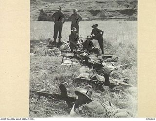 DALLMAN RIVER, NEW GUINEA, 1944-02-23. MEMBERS OF THE 2/14TH FIELD REGIMENT UNDERGOING BREN GUN TRAINING. IDENTIFIED PERSONNEL ARE: VX58159 GUNNER D.W.A. DIBBS (1); SX11263 SERGEANT L.E. BAXTER ..