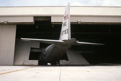 A Fleet Logistics Support Squadron 50 (VRC-50) C-130 Hercules aircraft is trapped by a partially collapsed hangar in the aftermath of Typhoon Omar which struck on August 29th, causing severe damage to Andersen; Naval Station, Guam; and the surrounding area