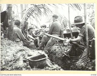 1943-08-14. NEW GUINEA. MOUNT TAMBU FIGHTING. ALLIED HEADQUARTERS FOR THE BATTLE FOR MOUNT TAMBU, WHICH WAS ONLY 75 YARDS FROM THE JAPANESE AND CONTINUALLY UNDER FIRE FROM MORTARS AND SNIPERS. ..