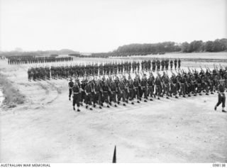 TOROKINA, BOUGAINVILLE. 1945-10-22. A CEREMONIAL PARADE AND MARCH PAST BY 29 INFANTRY BRIGADE WAS HELD FOR MAJOR-GENERAL BRIDGEFORD, GENERAL OFFICER COMMANDING 3 DIVISION, AT TOROKINA AIRFIELD. ..