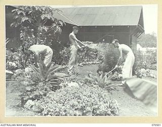 EGGY'S CORNER, PORT MORESBY AREA, PAPUA, 1944-02-19. NX71129 CAPTAIN E.D. WATSON, 554TH LIGHT ANTI-AIRCRAFT BATTERY, WITH VX40197 LIEUTENANT J.A. WATSON, 2/6TH HEAVY ANTI-AIRCRAFT BATTERY AND ..