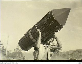 TOROKINA, BOUGAINVILLE ISLAND, SOLOMON ISLANDS. C. 1945-01-25. 42717 LEADING AIRCRAFTMAN R. MUDGE, TOORAK, VIC, AND A MEMBER OF NO. 5 (TACTICAL RECONNAISSANCE) SQUADRON RAAF BASED AT PIVA AIRFIELD, ..