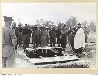 TOROKINA, BOUGAINVILLE, 1945-08-17. THE BURIAL SERVICE AT THE WAR CEMETERY OF CAPTAIN P.V. STRUGNALL CORPS OF AUSTRALIAN ELECTRICAL AND MECHANICAL ENGINEERS HEADQUARTERS 2 CORPS WHO DROWNED WHILE ..