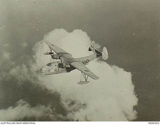 Qld. 1944-09-21. Martin PBM Marine flying boat, RAAF serial no. A70-12, registration VHCPL, of No. 41 Squadron RAAF based at Cairns, in flight. The pilot is 411319 Flight Lieutenant Fox of ..