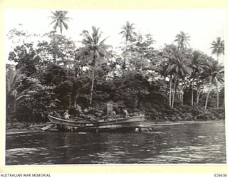 MILNE BAY, PAPUA. 1942-09. JAPANESE BARGES THAT WERE WRECKED AND SMASHED BY THE RAAF WHEN THE JAPANESE ATTEMPTED TO LAND AT MILNE BAY