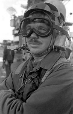 A view of a crewman on the flight deck of the amphibious assault ship USS GUAM (LPH 9), during operations off the coast of Beirut, Lebanon