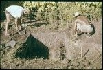 Vaiohu'a archaeological excavation: pit and men working